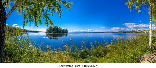 Beautiful Lake With Blue Sky And White Clouds