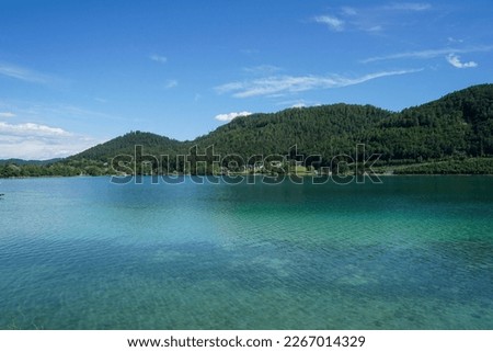 Similar – Image, Stock Photo I see a lake with dramatic clouds and trees reflected in the water
