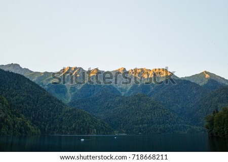 Beautiful lake ritsa in Abkhazia. Landscape of the mountains of the forest and the lake