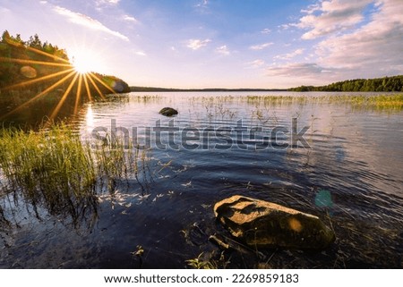 Beautiful lake Saimaa at sunset. Summer in Finland