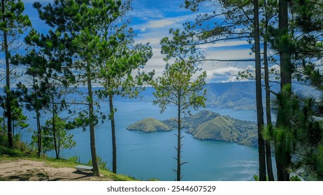 Beautiful lakeside view from a lake Toba, with lush green trees, blue sky and sunlight - Powered by Shutterstock