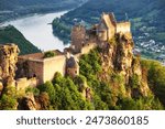 Beautiful landscape with Aggstein castle ruin and Danube river at sunset in Wachau, Austria