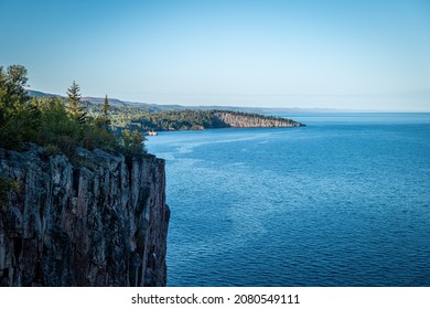Beautiful landscape along the north shore of Lake Superior in Minnesota, from Palisade Head, a natural sheer cliff at the edge of the blue water. Evening image at the shore of Gitchi-Gami.