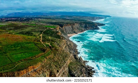 Beautiful Landscape Of Atlantic Ocean Coastline, Portugal. Aerial View Of Scenic Tourist Travel Destination. No People. Summer. Cloudy Sky. Drone Top View - Natural Seascape With Ocean Rocky Shore