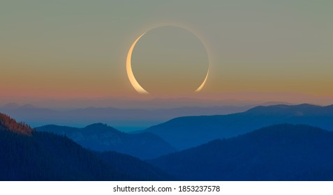 Beautiful landscape with cascade blue mountains at the morning with solar eclipse - View of wilderness mountains during foggy weather
