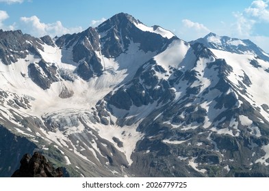 Beautiful landscape with the Caucasus mountains. Snow-capped peaks of the mountains from a height.