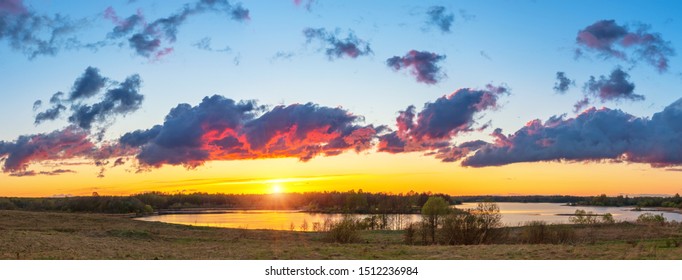 Beautiful Landscape With Colorful Sunset Over Forest Lake