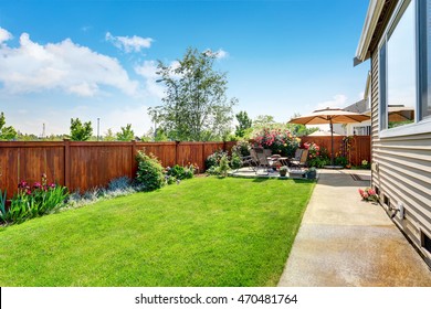 Beautiful landscape design for backyard garden and patio area on concrete floor. Northwest, USA - Shutterstock ID 470481764