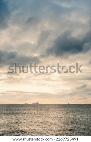 Beautiful landscape with dramatic sky, sea water and islands