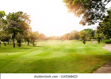 Beautiful landscape of golf course in the countryside in sunset, sunrise time. Asia, Thailand.