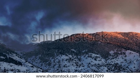 Beautiful Landscape of High Mountain Covered with Snow in the Mist. Mild Sunset Light. Winter Cold Weather. Lebanon.