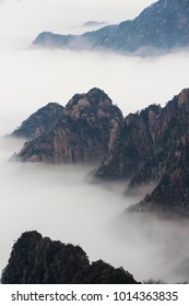 Beautiful landscape of Huangshan National Park in China with rime sea of cloud and fog after sunrise. It's known for pine tree forest and rime sea of cloud.