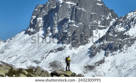 Similar – Image, Stock Photo Backpacker resting.