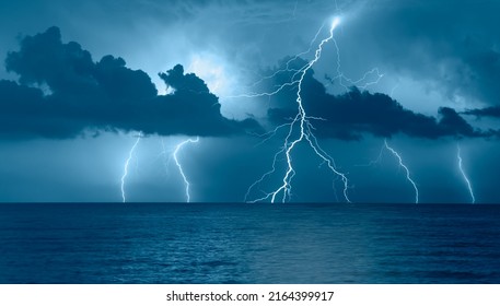 Beautiful landscape with lightning over the calm sea  - Powered by Shutterstock