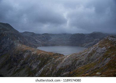 A beautiful landscape of a mountain lake in Folgefonna National Park in Norway. Overcast autumn day in mountains. Autumn scenery of lake. - Shutterstock ID 1189574080