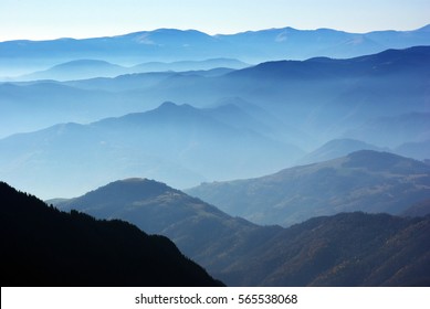 Beautiful landscape with mountain ridges in the distance, from Fagaras Mountains in Romania  - Shutterstock ID 565538068