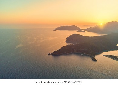 Beautiful Landscape Of Mysterious Scenic Idyllic Mountains In The Sea Lagoon In Haze At Sunset. Soft Focus Wallpaper 