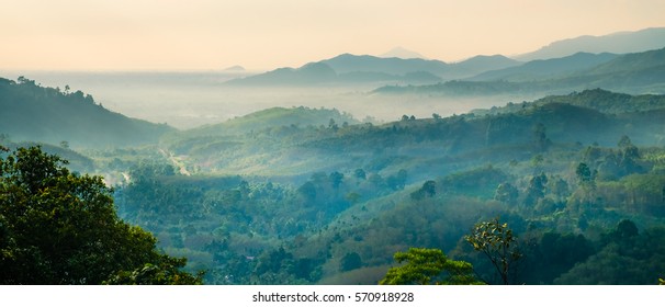 Beautiful Landscape Nature Of Rain Forest And Mountain Background. Abundance Evergreen Forest And Foggy In Spring. Nice Place For Outdoor Travel On Vacation Or Holidays. Tropical Forest Of Thailand.