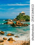 Beautiful landscape with ocean view and blue sky on the beaches of Tayrona Park. Santa Marta, Colombia.