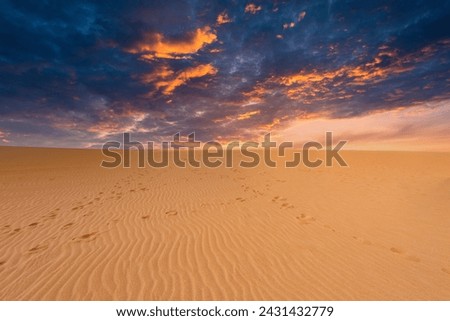 Beautiful landscape with orange sunset in the Taroa dunas and sea view. Guajira, Colombia. 