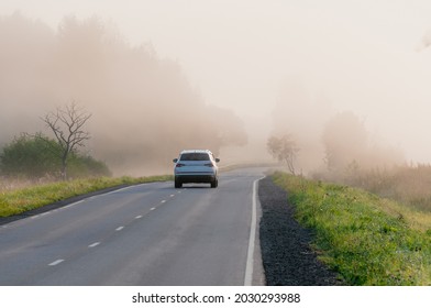 Beautiful landscape overlooking the road in the fog, car - Powered by Shutterstock