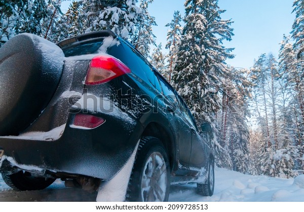 Beautiful landscape overlooking the snowy forest,\
car, travel