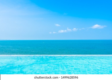 Beautiful landscape of sea ocean with outdoor swimming pool on white cloud blue sky background for leisure travel and vacation