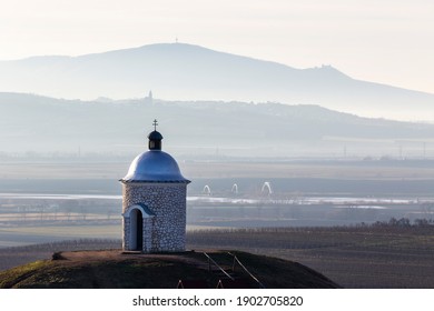 Beautiful landscape of South Moravia. In the foreground on the hill stands the chapel Hradištěk. In the background the Pálava Mountains and Devicky Castle.