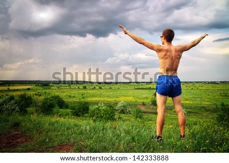 Similar – sports guy in his underwear looking at the river