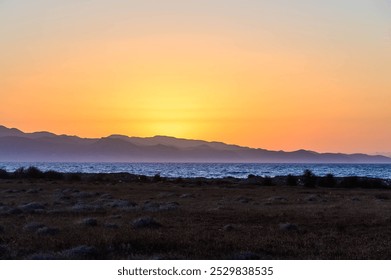 Beautiful landscape with a stunning sunset. Rocky coastline and mountains. Cyprus - Powered by Shutterstock