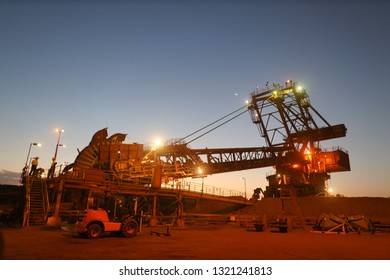 Beautiful Landscape Sunrise At Reclaimer Wheel Bucket At Early Morning Construction Mine Site Pilbara Region Perth, Australia   