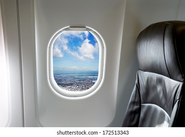 Beautiful landscape through aircraft window onto jet engine Stock Photo