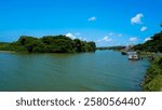 beautiful landscape view of Bharathapuzha, kerala river, Houseboat Bharathapuzha in blue sky, Small Canoes on the banks of River, Nature background, backwaters of Kerala, Nila River view, island view