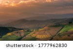 Beautiful landscape view of rice terraces and house on mountains beautiful shape in nature at pa-pong-peang rice terrace north Thailand.The village is in a valley among the rice terraces. Terraced Pad