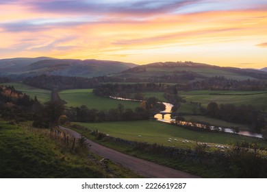 Beautiful landscape view at sunset in Autumn of rolling hills and rural countryside with Old Manor Bridge over the River Tweed near Peebles in the Scottish Borders of Scotland, UK. - Powered by Shutterstock