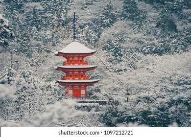 Beautiful landscape in winter seasonal : Red Japanese pagoda covered with white snow in Kiyomizu-dera Temple, Kyoto, Japan.