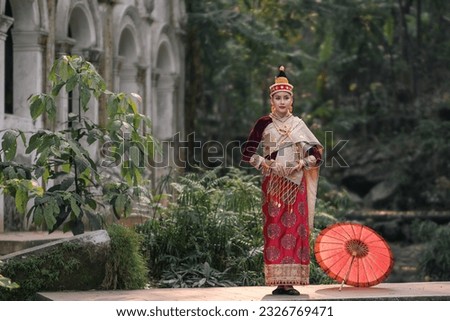 Beautiful Laos girl dressed in ancient luxury national traditional Laos clothes costume. Asian young woman wearing antique traditional Laos Luang Prabang elegantly ethnic clothes culture vintage.