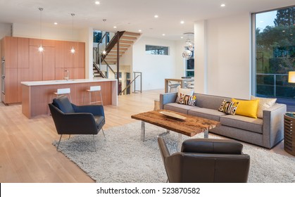 Beautiful Large Living Room Interior With Hardwood Floors, Fluffy Rug And Designer Furniture. 