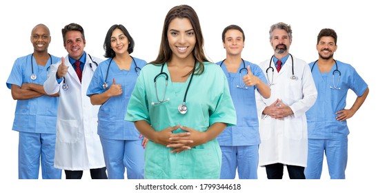 Beautiful Latin American Female Nurse With Doctor And Medical Team Isolated On White Background For Cut Out