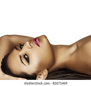 Beautiful Latin Model With Tan With Fresh Summer Fashion Make-up And Dark Liner On Her Eyes Lying On Her Long Wet Hair .