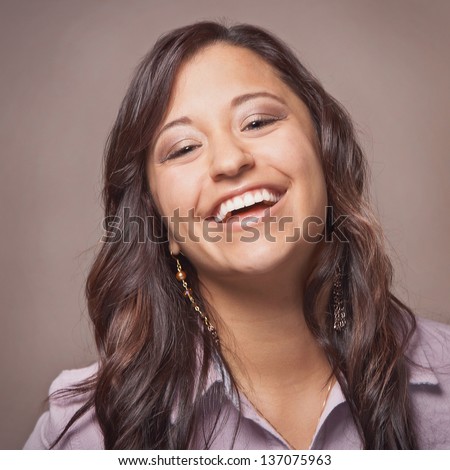 Beautiful laughing ethnic happy young woman