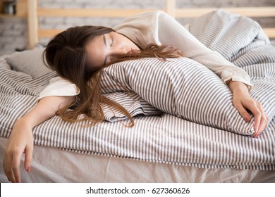 Beautiful Lazy Asian Woman Sleeping On The Bed At Late Morning