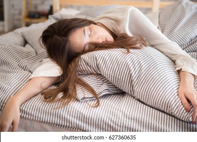 Beautiful Lazy Asian Woman Sleeping On The Bed At Late Morning