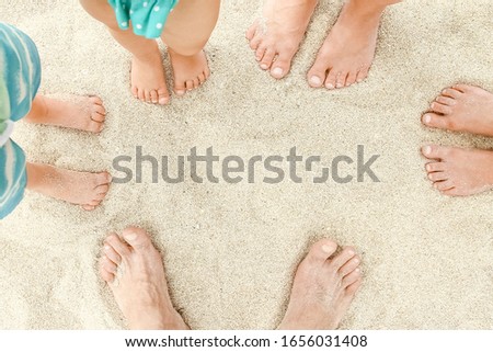 beautiful legs in the sand of the sea greece background