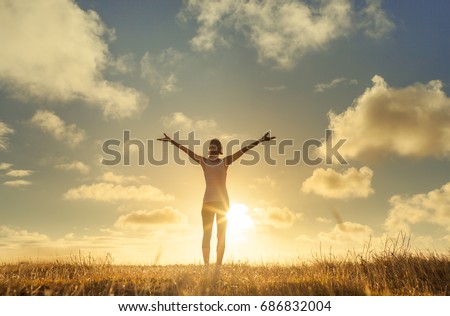 It's a beautiful life. Happy people lifestyle. Young woman in a nature setting with her arms in the air feeling free and energized.  Foto stock © 