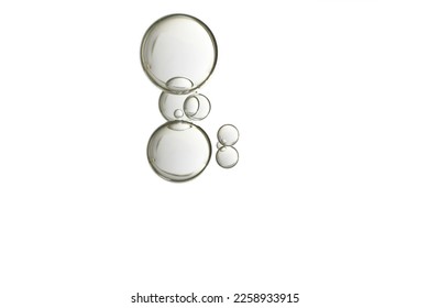 Beautiful light beige water blobs, isolated over a white background.