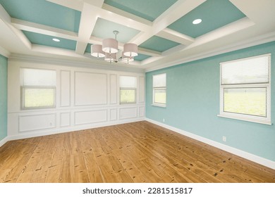 Beautiful Light Blue Custom Master Bedroom Complete with Entire Wainscoting Wall, Fresh Paint, Crown and Base Molding, Hard Wood Floors and Coffered Ceiling - Shutterstock ID 2281515817