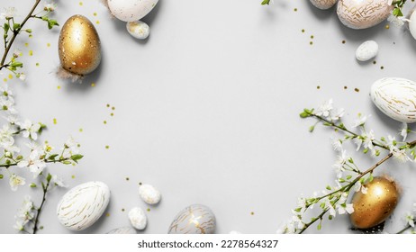 beautiful light easter layout with marble eggs, cherry blossoms and confetti on a white background. top view. copy space. flat lay. place for text - Powered by Shutterstock