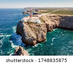 Beautiful lighthouse located on high cliffs of Saint Vincent cape  in Sagres, Algarve, Portugal