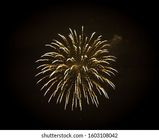 Beautiful lights fireworks exploding in night black sky. Holiday festival style. Pyrotechnics amazing background. Celebration abstract fire.